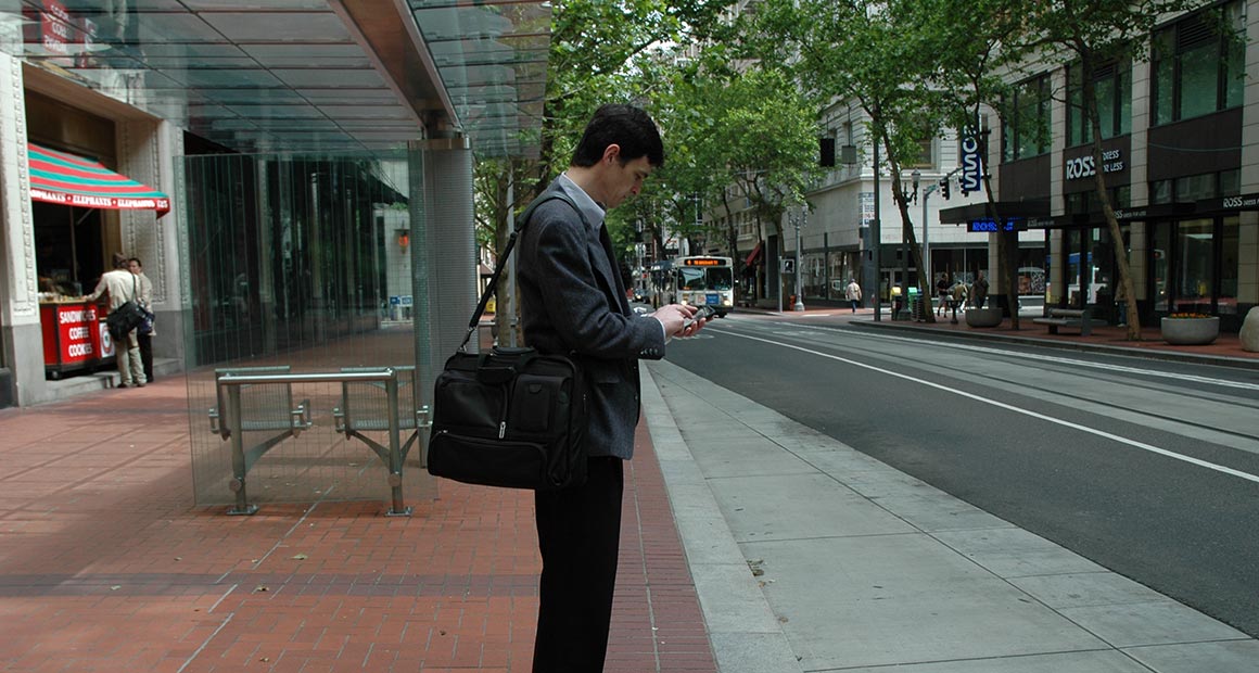 Person accessing TransitTracker on a mobile phone